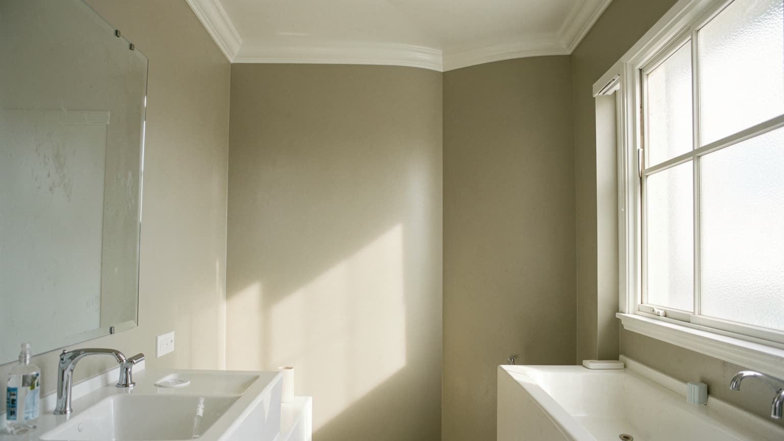 Master bathroom painted with the best paint for bathrooms, showing smooth satin greige walls and clean white trim.