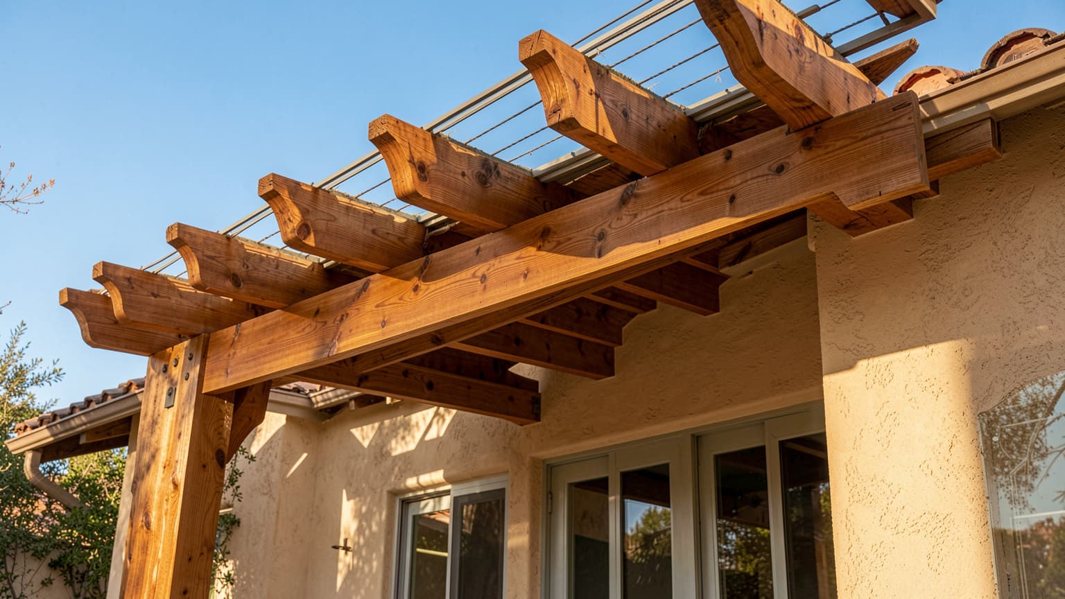 Exterior patio cover with exposed timber rafter tails on an Orange County home ready for house staining.